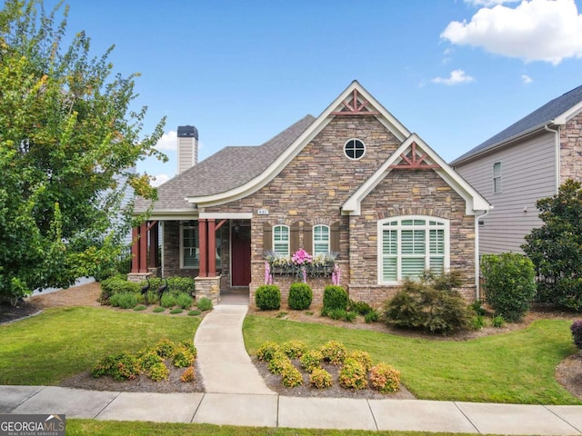 craftsman house with a front lawn