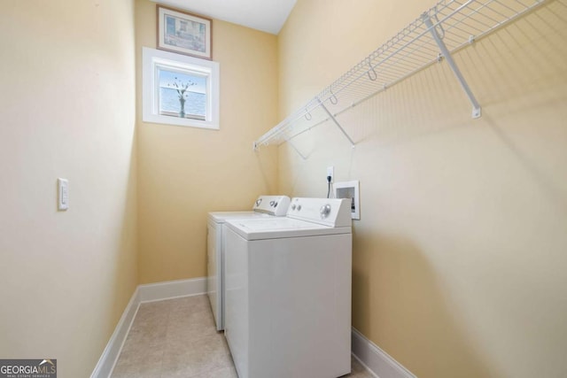 clothes washing area with independent washer and dryer