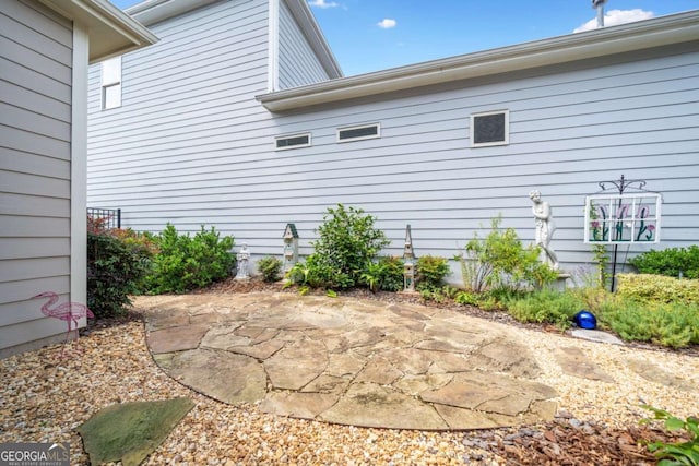 view of home's exterior featuring a patio area