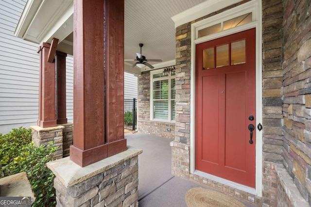 property entrance featuring covered porch and ceiling fan