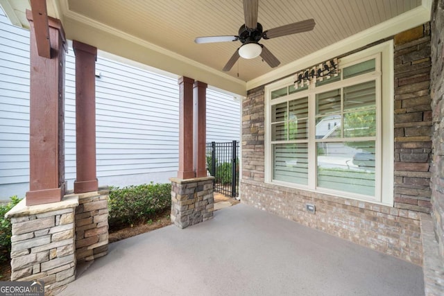 view of patio featuring ceiling fan and a porch