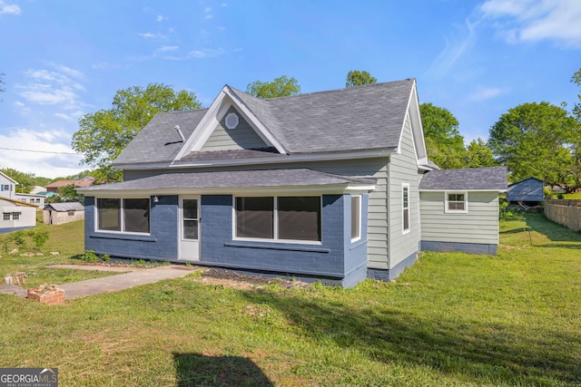 view of front of home with a front yard