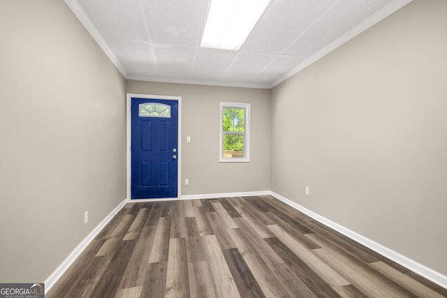 entrance foyer with dark hardwood / wood-style floors and ornamental molding