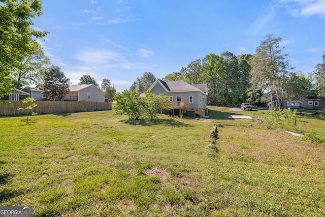 view of yard featuring a wooden deck