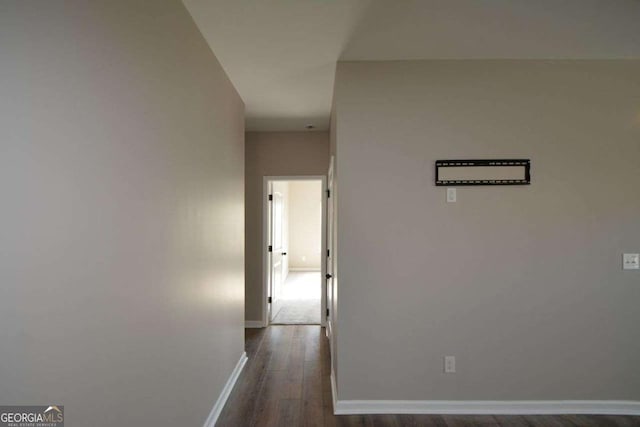 corridor featuring dark hardwood / wood-style flooring