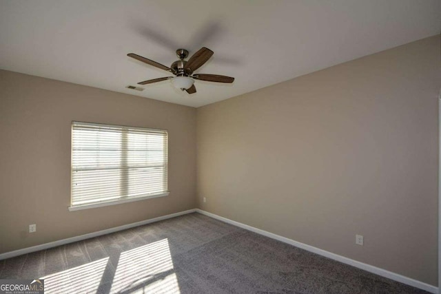 carpeted empty room featuring ceiling fan