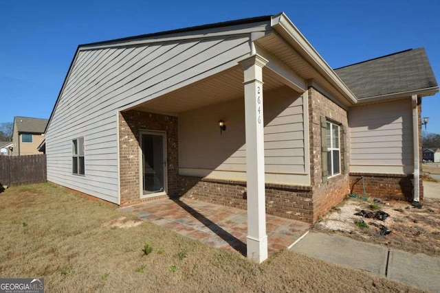 view of home's exterior featuring a yard and a patio area