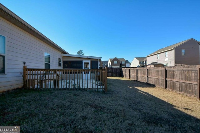 view of yard featuring a wooden deck