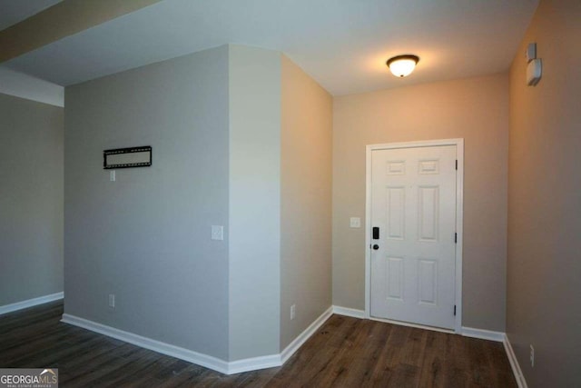 foyer entrance with dark wood-type flooring