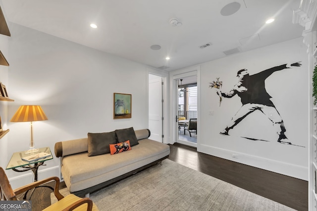 living room with dark hardwood / wood-style flooring