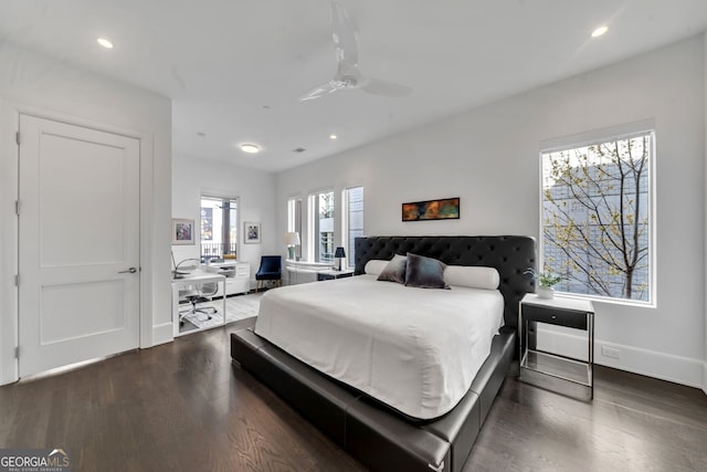 bedroom featuring ceiling fan and dark hardwood / wood-style flooring