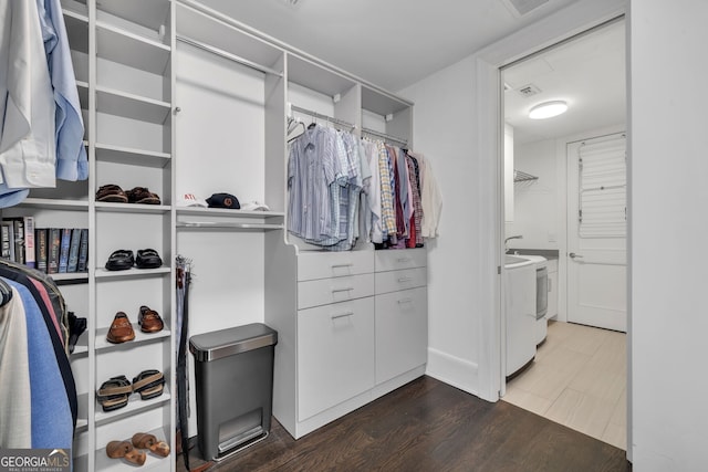 spacious closet with washer and dryer