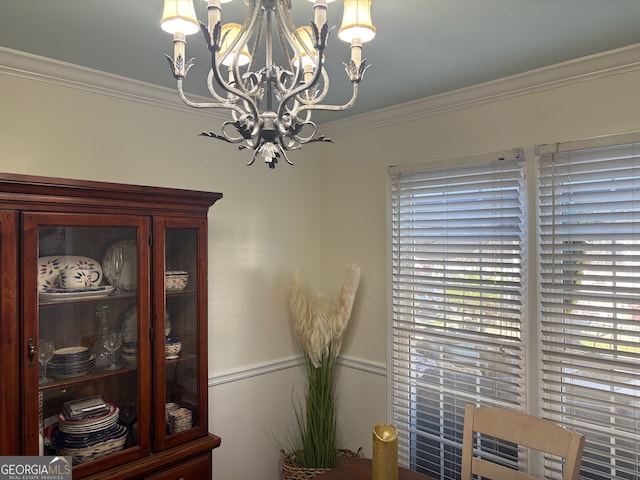 interior details featuring a notable chandelier and ornamental molding