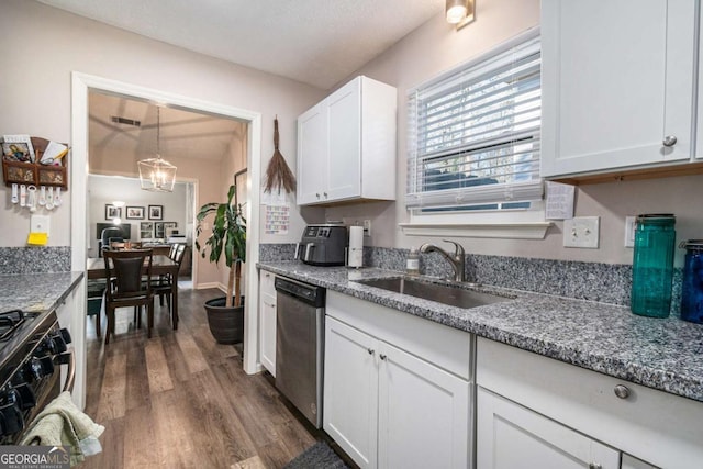 1276 Westover Trce NW, Acworth, GA 30102 - kitchen featuring stainless steel dishwasher, gas stove, white cabinetry, dark wood finished floors, and dark stone countertops
