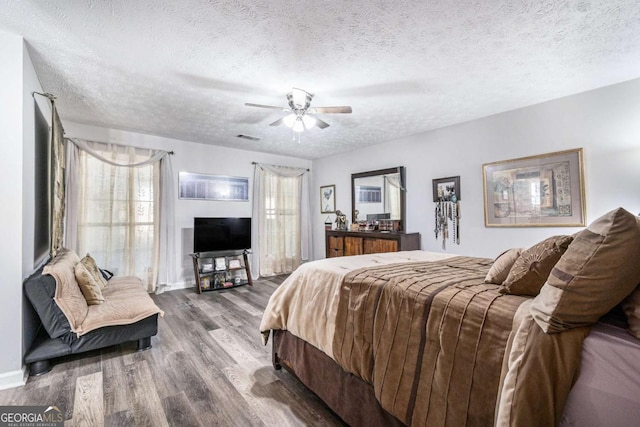 1276 Westover Trce NW, Acworth, GA 30102 - bedroom with wood finished floors, a textured ceiling, and ceiling fan