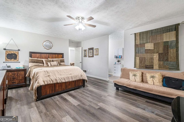 1276 Westover Trce NW, Acworth, GA 30102 - bedroom featuring wood finished floors, a textured ceiling, and ceiling fan