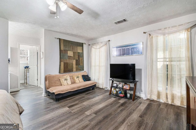 1276 Westover Trce NW, Acworth, GA 30102 - living room with dark wood finished floors, a ceiling fan, and a textured ceiling