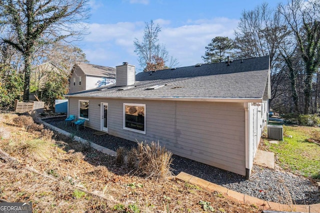 back of house featuring central AC