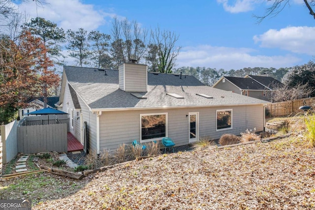 1276 Westover Trce NW, Acworth, GA 30102 - rear view of house with a chimney and a shingled roof