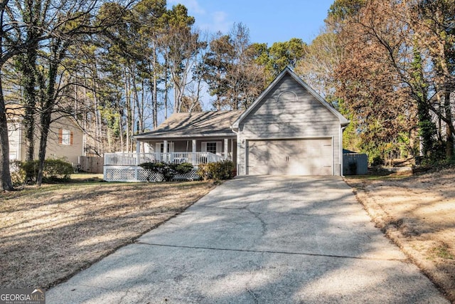 view of front facade featuring a porch and a garage