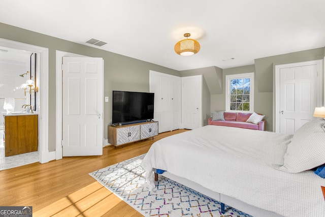 bedroom with wood-type flooring