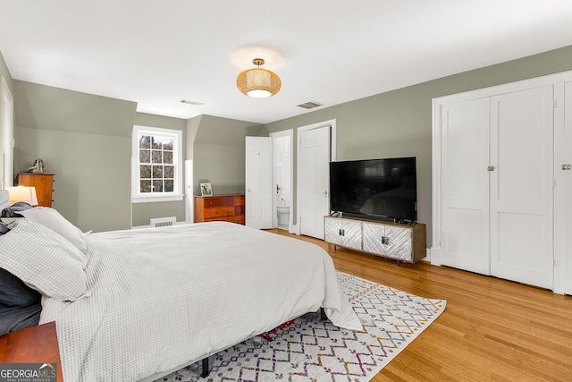 bedroom with hardwood / wood-style floors