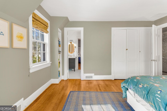 bedroom featuring hardwood / wood-style flooring