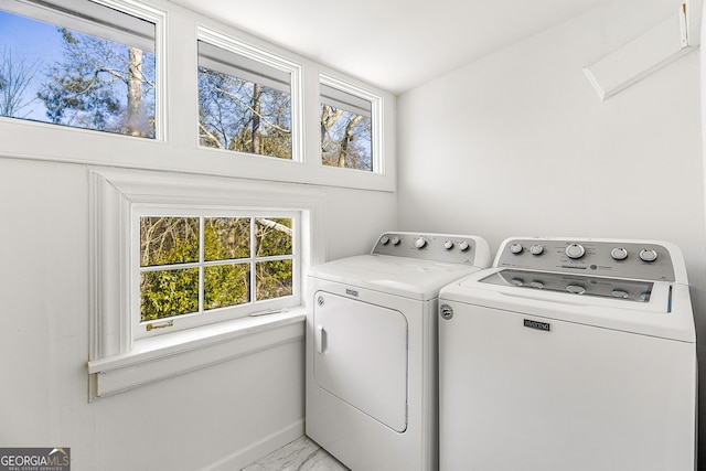 laundry area featuring washing machine and dryer