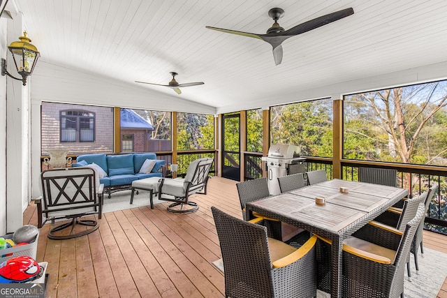 sunroom featuring ceiling fan, wood ceiling, and lofted ceiling