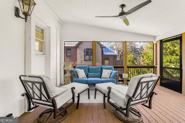 sunroom / solarium with ceiling fan, wooden ceiling, and vaulted ceiling