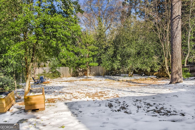 view of yard covered in snow