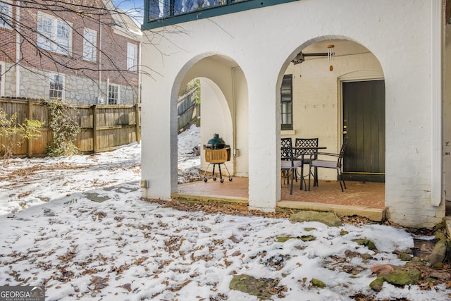 view of snow covered patio