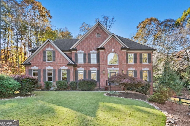 colonial-style house with a front lawn