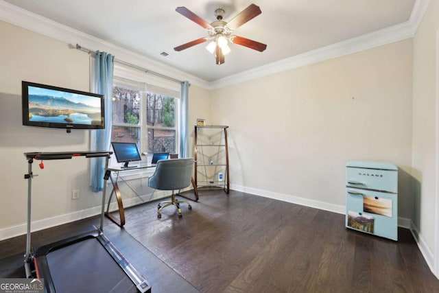 office space with dark wood-type flooring, ceiling fan, and ornamental molding