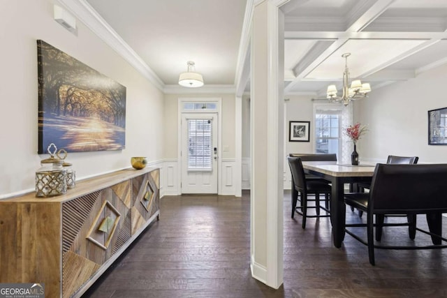 dining area featuring a healthy amount of sunlight, dark hardwood / wood-style flooring, ornamental molding, and coffered ceiling