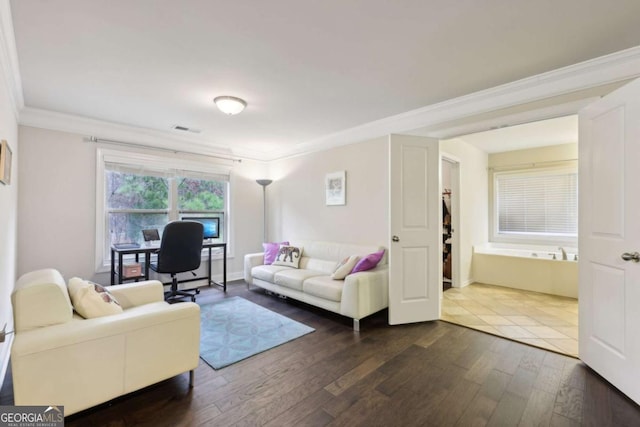 living room with dark hardwood / wood-style flooring and ornamental molding