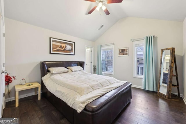 bedroom with ceiling fan, dark hardwood / wood-style floors, and vaulted ceiling