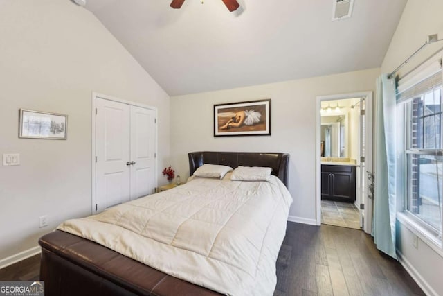 bedroom featuring lofted ceiling, ensuite bathroom, ceiling fan, dark hardwood / wood-style floors, and a closet