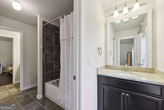 bathroom featuring shower / bath combination with curtain and vanity