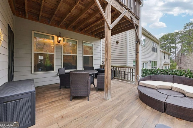 wooden deck with an outdoor hangout area