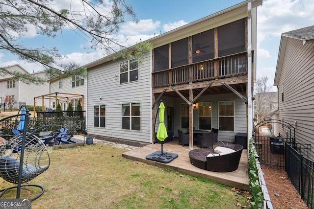 back of property featuring a yard, an outdoor hangout area, and a sunroom