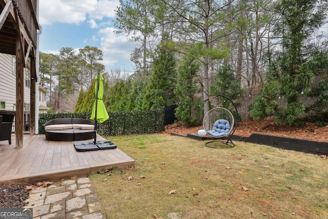 view of yard featuring an outdoor fire pit and a wooden deck