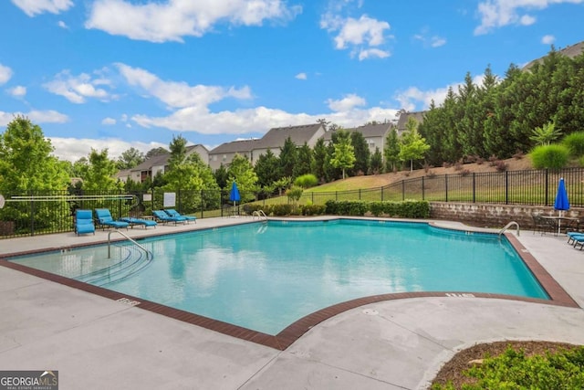 view of pool featuring a patio area