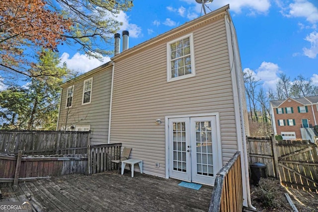 back of house with french doors and a wooden deck