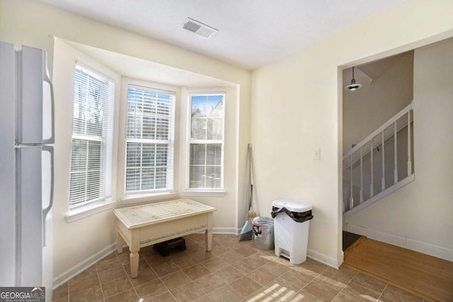 living area featuring light tile patterned flooring