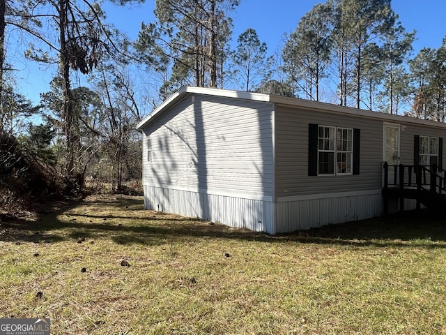 view of property exterior featuring a yard