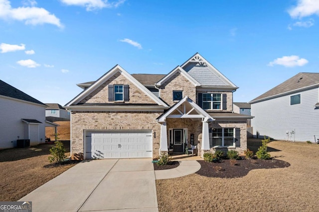 craftsman-style house featuring central AC and a garage