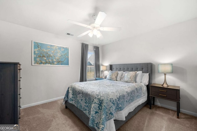 bedroom with light colored carpet and ceiling fan