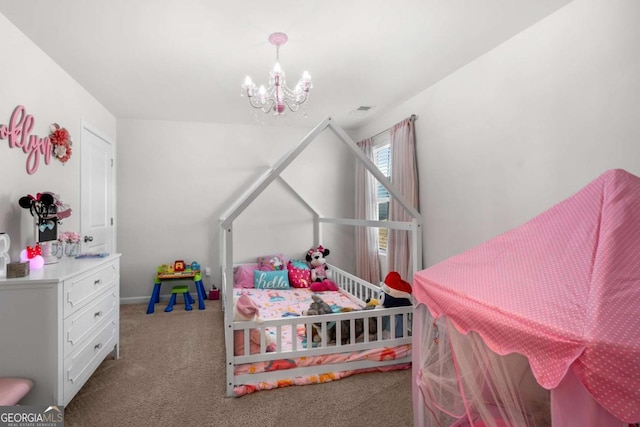 carpeted bedroom with a notable chandelier