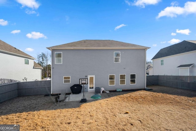 back of property featuring a lawn and a patio